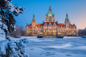 City Hall of Hannover, Germany in winter with snow and frozen lake City Hall of Hannover, Germany in winter with snow and frozen lake